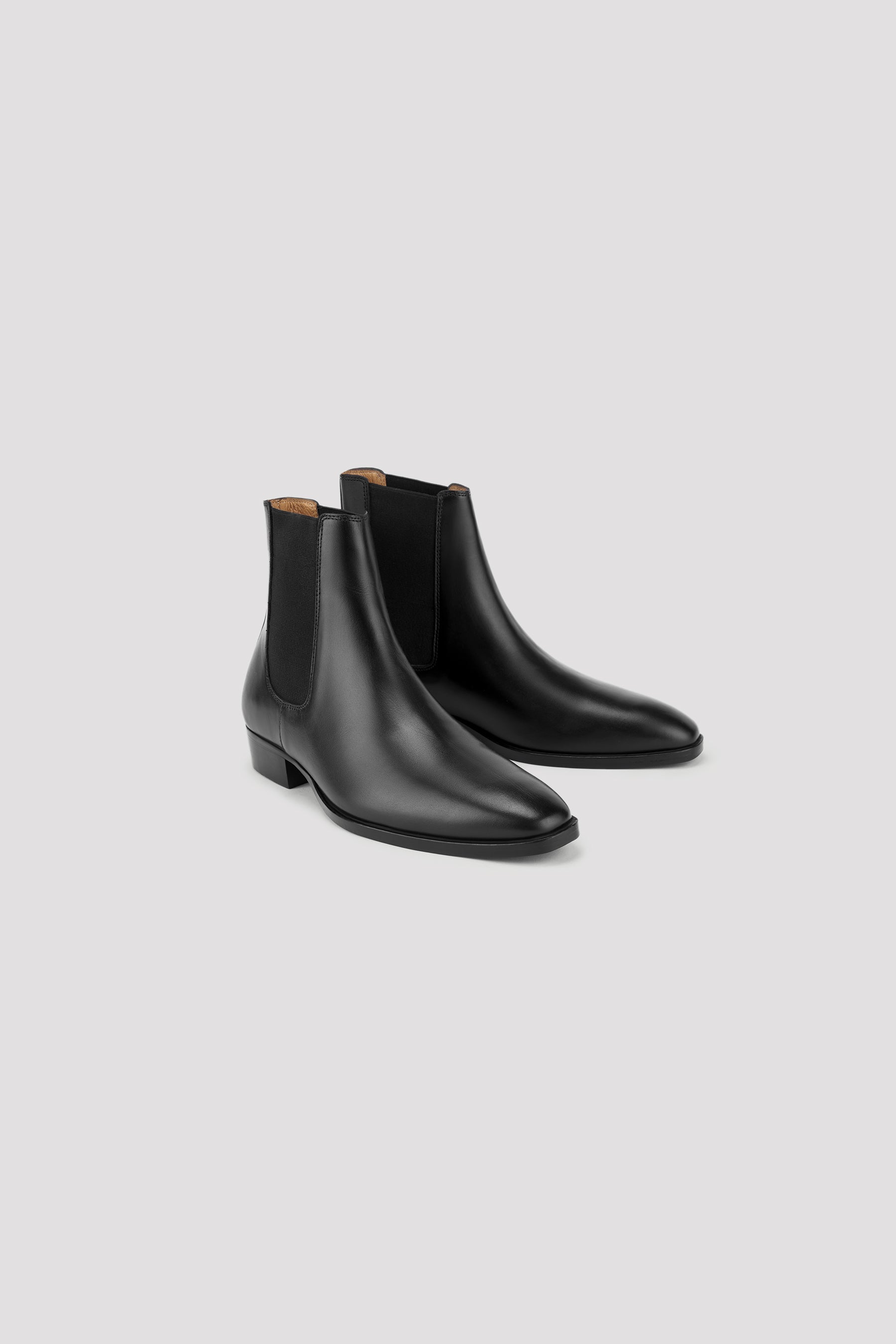 Black Leather Chelsea Boots: Made in Italy, Minimalist Design, Elasticated Sides, Cuban Heels. 